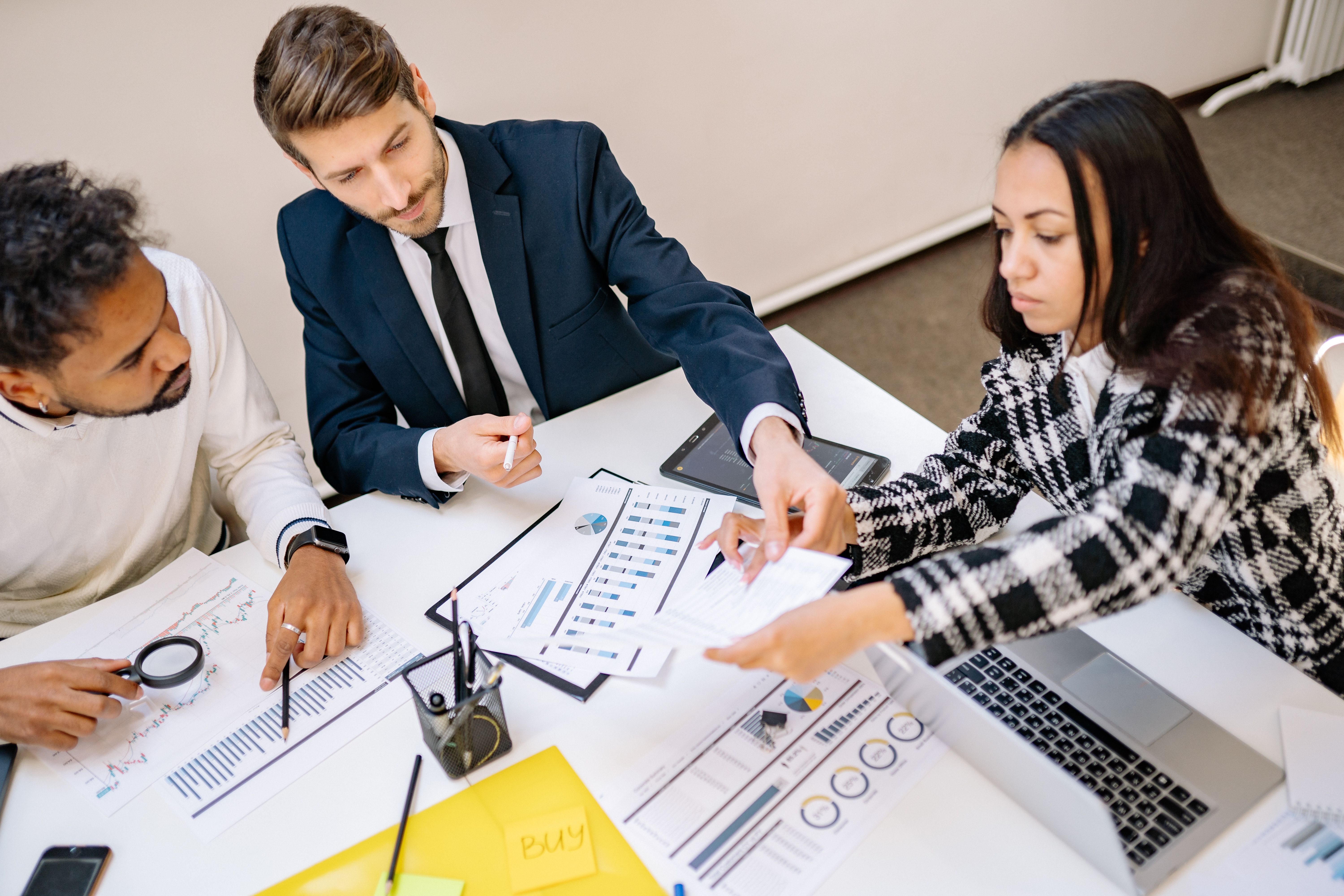 Business professionals reviewing documents during a collaborative meeting