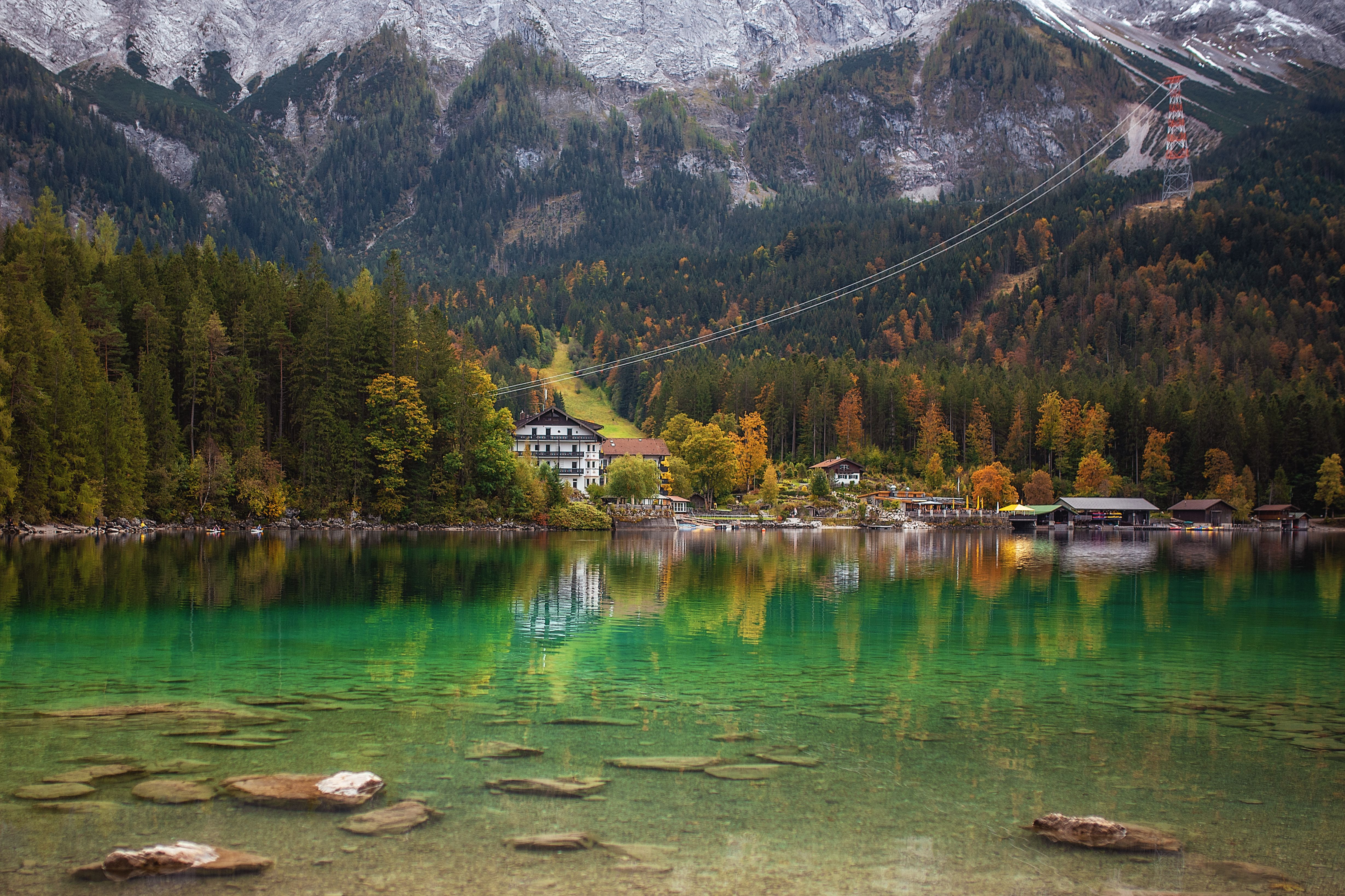 Vibrant alpine lake near Grainau, Bavaria, framed by mountain peaks and clear green water.